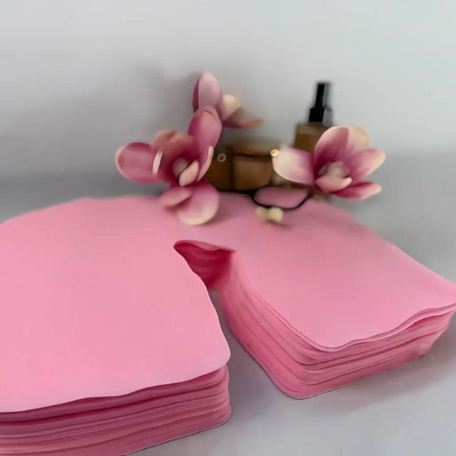 Silk vienkartiniai rožiniai neaustiniai masažo stalo veido angos uždangalai 100 vnt – higieninė apsauga salonams