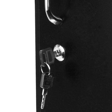 Black salon trolley lock with set of keys in keyhole, close-up view