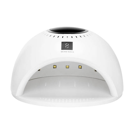 OCHO NAILS 8 balta UV/LED nagų lempa – 84 W galia užtikrina greitą kietinimą kiekvienos procedūros metu