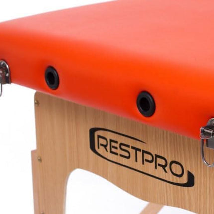 Oranžinės spalvos RESTPRO Classic-2 masažo stalas moderniam grožio ir wellness salonui