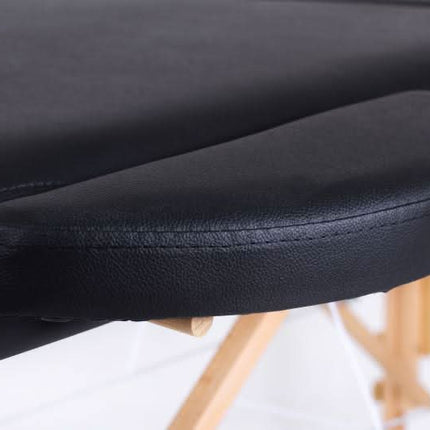 RESTPRO juoda masažo kušetė iš šono – kompaktiškas dizainas kirpykloms ir SPA centrui